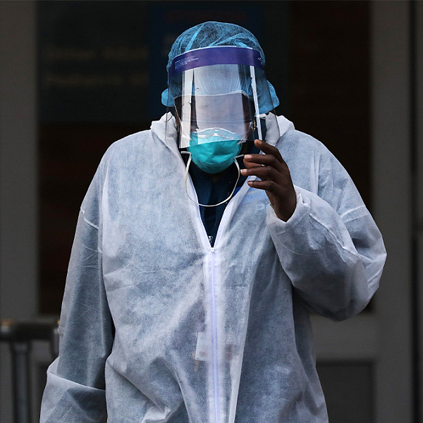 a black nurse in full PPE