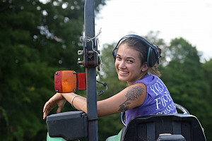 Keely Curliss on a tractor.