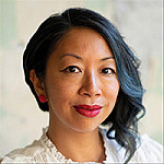 Jen, a Filipina-American gender-nonconforming person, wears pink lipstick and stud earrings. Thei...